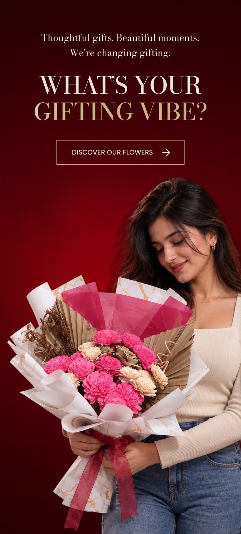 Thoughtful gifts. Beautiful moments. We’re changing gifting. What’s your gifting vibe? A woman in a cream top looking down at a pink and ivory bouquet wrapped in gold-marbled paper
